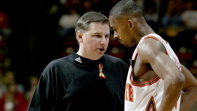 Iowa State head coach Larry Eustachy talks with Marcus Jefferson during NIT Tournament basketball game against Wichita State wednesday night in Ames.