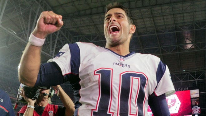 New England Patriots quarterback Jimmy Garoppolo (10) celebrates after beating the Arizona Cardinals.