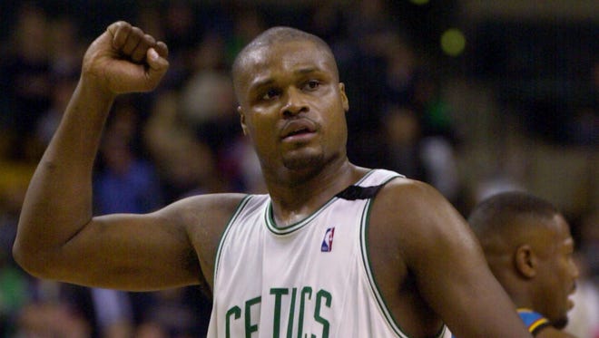 2000: Antoine Walker reacts with a raised fist near the end of Boston's 103-83 victory over the Detroit Pistons.