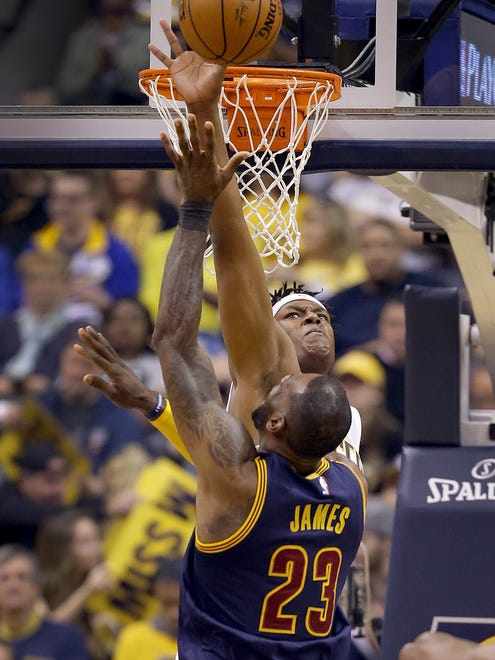 Indiana Pacers center Myles Turner (33) attempts to block the shot by Cleveland Cavaliers forward LeBron James (23) in the first half of their NBA playoff basketball game Sunday, April 23, 2017, afternoon at Bankers Life Fieldhouse.