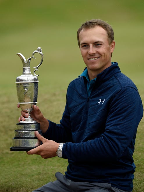 Jordan Spieth holds the Claret Jug after winning the 146th Open Championship golf tournament at Royal Birkdale Golf Club.