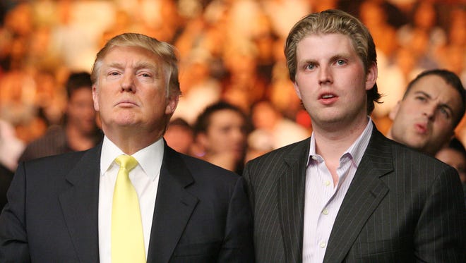 Donald Trump, left, and son Eric Trump watch the Tito Ortiz against Lyoto Machida UFC Light Heavyweight fight at the MGM Grand Garden Arena on May 24, 2008, in Las Vegas.
