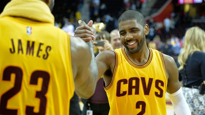 2015: LeBron James celebrates with Kyrie Irving after a win over the Chicago Bulls.