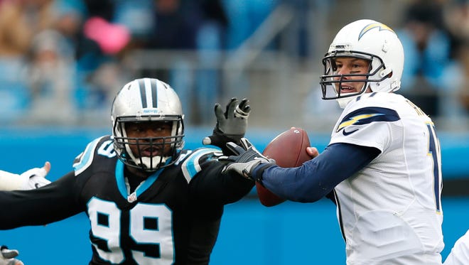 Carolina Panthers defensive tackle Kawann Short (99) applies pressure to San Diego Chargers quarterback Philip Rivers (17) in the first quarter at Bank of America Stadium.