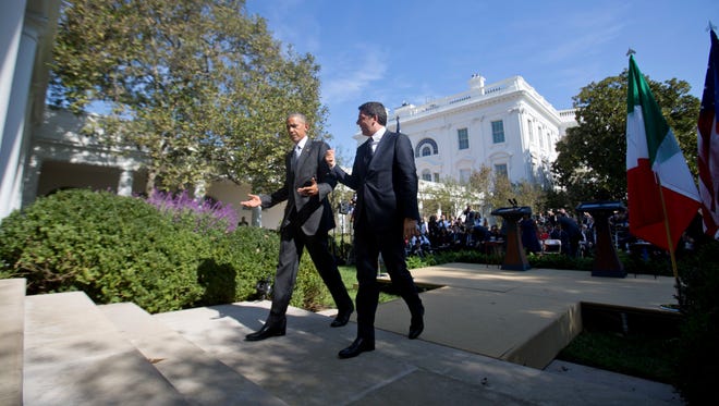 Obama and Italian Prime Minister Matteo Renzi leave their joint news conference in the Rose Garden of the White House on Oct. 18, 2016.