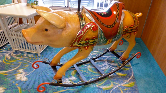 Curated by the ship's owners from antique shops in New Orleans, the American
Eagle has some authentic, whimsical decorative touches, including this vintage “rocking pig” in the Sky Lounge.