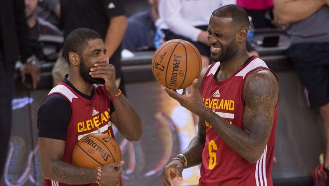 2016: Kyrie Irving and forward LeBron James talk during NBA Finals media day.