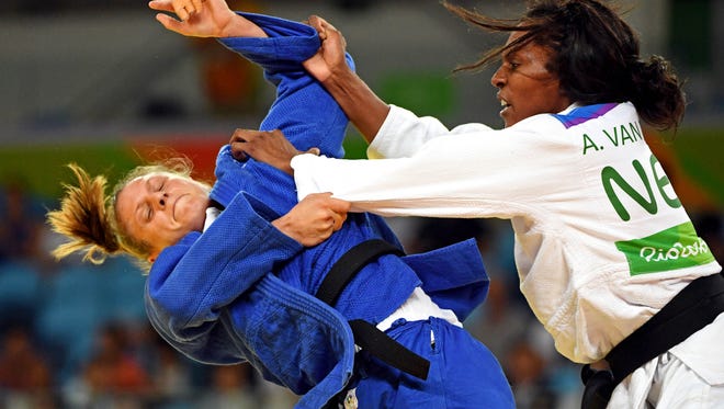 Anicka van Emden of the Netherlands, right, fights against Alice Schlesinger during women's judo 63kg round 16 in the Rio 2016 Summer Olympic Games at Carioca Arena 2.