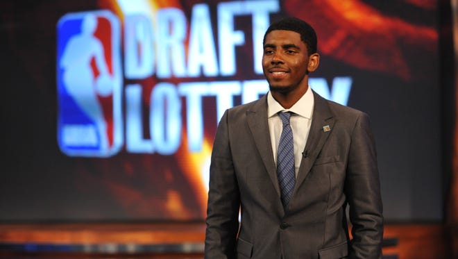 2011: Kyrie Irving poses for a picture prior to the draft lottery.