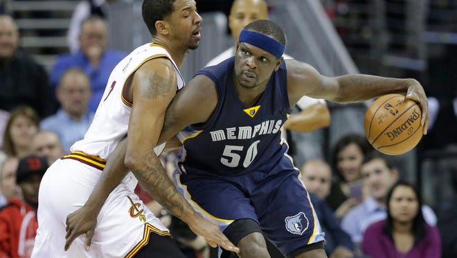 Memphis Grizzlies' Zach Randolph (50) tries to get past Cleveland Cavaliers' Channing Frye (8) in the second half of an NBA basketball game Tuesday, Dec. 13, 2016, in Cleveland. (AP Photo/Tony Dejak)
