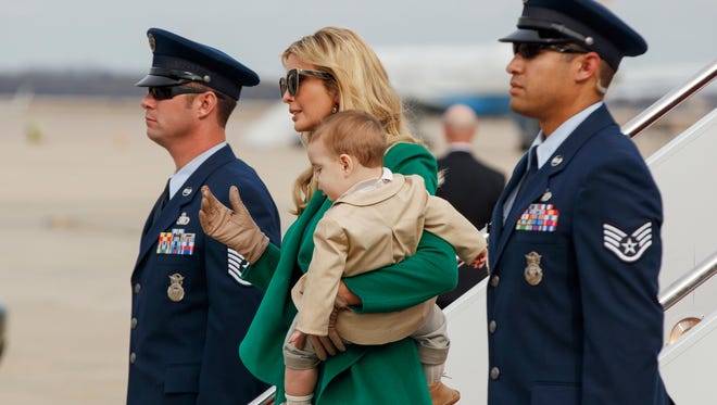 Ivanka Trump carries her son Theodore Kushner, as they arrive at Andrews Air Force Base, Md., Jan. 19, 2017, for her father's inauguration.