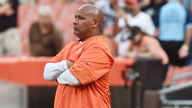 Cleveland Browns head coach Hue Jackson watches the team stretch prior to the game between the Cleveland Browns and the New Orleans Saints at FirstEnergy Stadium.