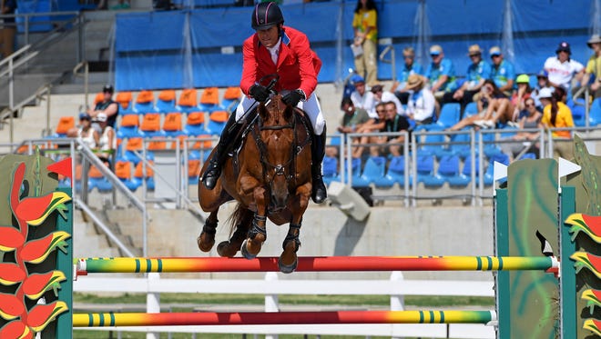 Boyd Martin of the United States rides Blackfoot Mystery during equestrian eventing jumping in the Rio 2016 Summer Olympic Games at Olympic Equestrian Centre.