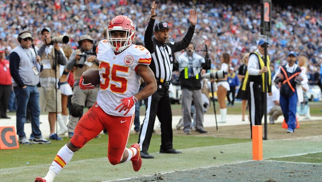 Chiefs running back Charcandrick West (35) scores a touchdown during the first half against the Chargers.