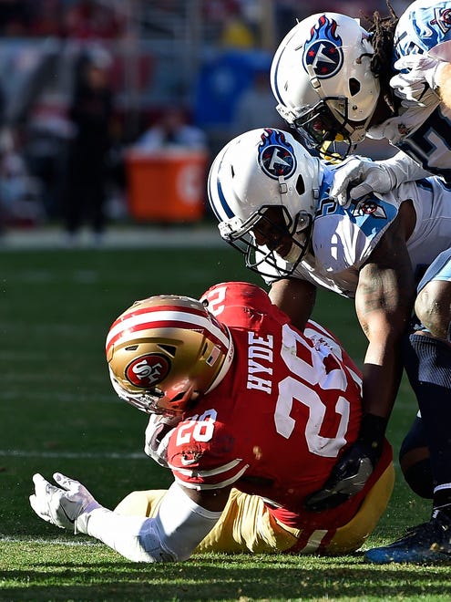 Titans linebacker Avery Williamson (54) stops 49ers running back Carlos Hyde (28) short of the touchdown in the first quarter at Levi's Stadium Sunday, Dec. 17, 2017 in Santa Clara, Calif.
