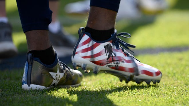 Cleats worn by Titans linebacker Avery Williamson (54)  in honor of Wounded Warriors as part of the NFL's ''My Cause, My Cleats'' program at Nissan Stadium Sunday, Dec. 3, 2017 in Nashville, Tenn.