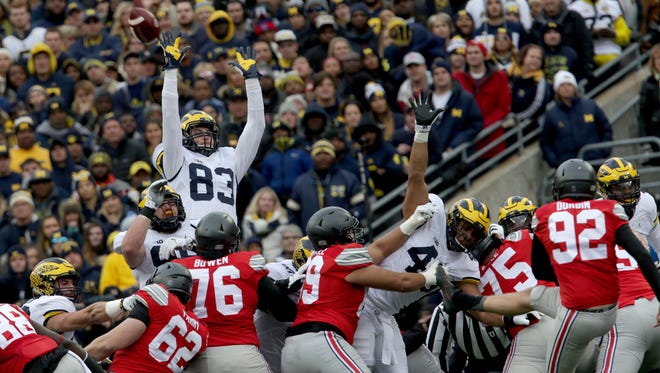 Michigan's Zach Gentry (83) tries to block a field goal by Ohio State in the first half at Ohio Stadium on Saturday, Nov. 26, 2016.