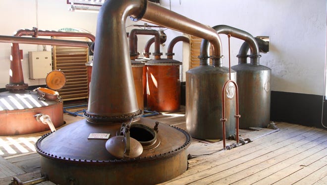 The distillery uses both pot and column stills for production.