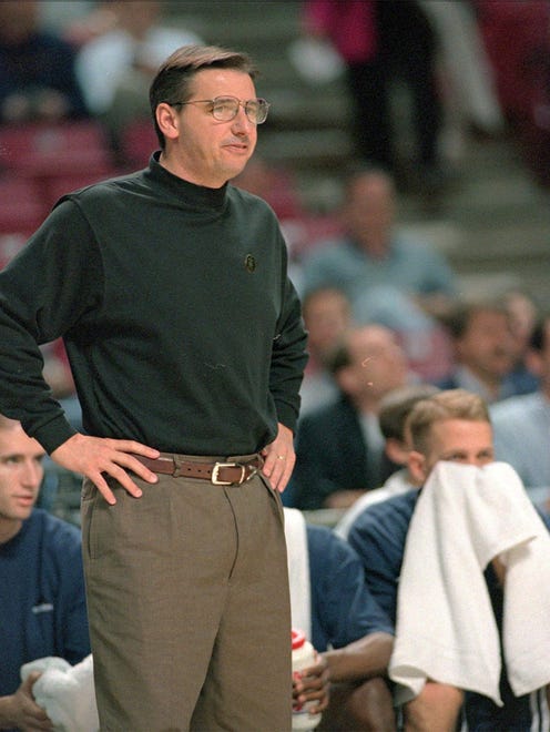 Larry Eustachy, left, as the coach at Utah State in 1998.