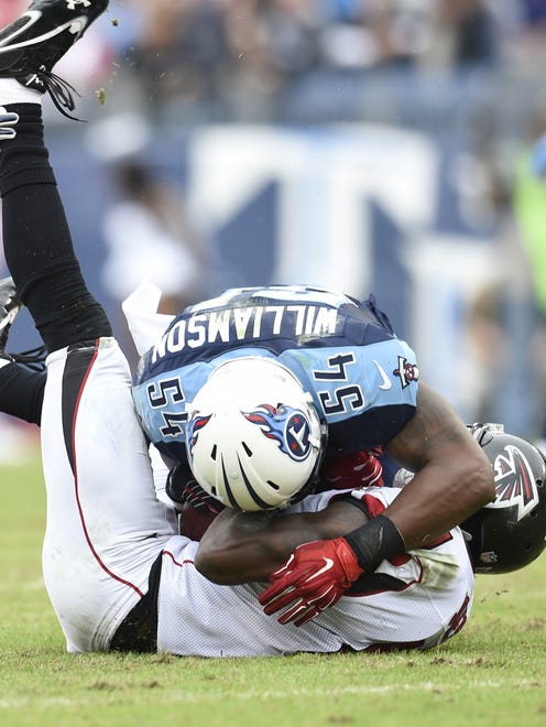 Titans inside linebacker Avery Williamson (54) tackles a Falcons player at Nissan Stadium on Oct. 25, 2015.