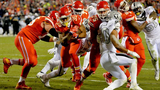 Kansas City Chiefs running back Charcandrick West (35) runs for a touchdown during the first half against the Oakland Raiders at Arrowhead Stadium.