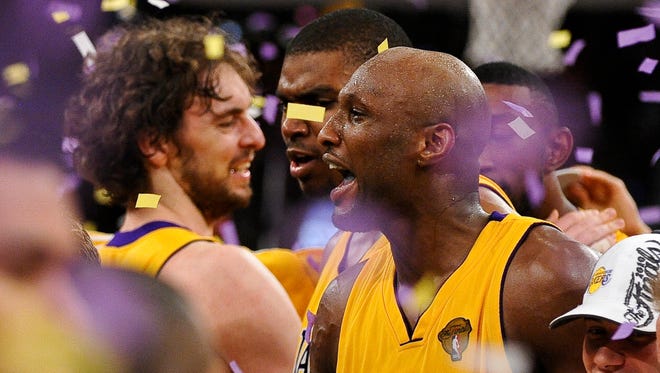 Lamar Odom, Pau Gasol and Andrew Bynum celebrate the Lakers' 83-79 win over Boston in game 7 of the NBA Finals. (Jun 2010)