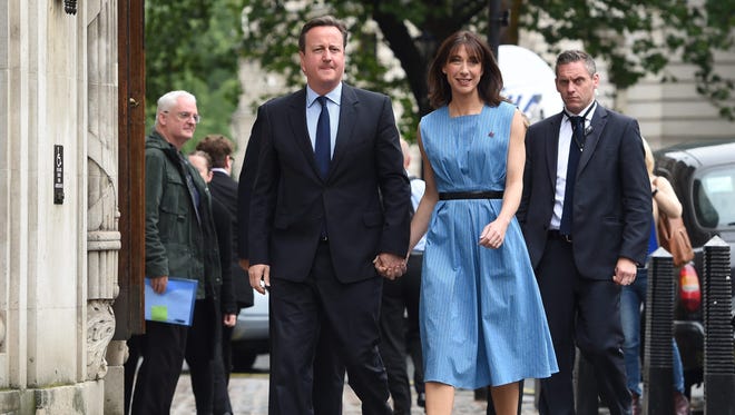 British Prime Minister David Cameron and his wife, Samantha, leave after voting in the EU Referendum at the Central Methodist Hall in London.