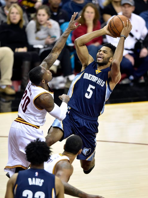 Dec 13, 2016; Cleveland, OH, USA; Memphis Grizzlies guard Andrew Harrison (5) drives to the basket against Cleveland Cavaliers guard Kay Felder (20) in the second quarter at Quicken Loans Arena. Mandatory Credit: David Richard-USA TODAY Sports