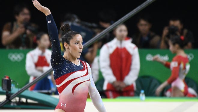 Aly Raisman (USA) competes during the women's team finals in the Rio 2016 Summer Olympic Games at Rio Olympic Arena.