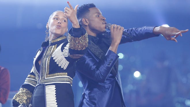 'The Voice' winner Chris Blue, right, sings with his coach, Alicia Keys, on the Season 12 finale of 'The Voice.'