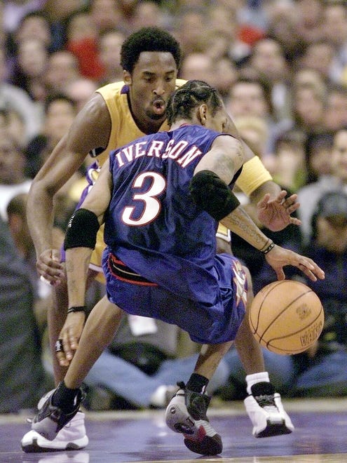 Kobe Bryant defends Allen Iverson during the Lakers' 96-85 win at the Staples Center.