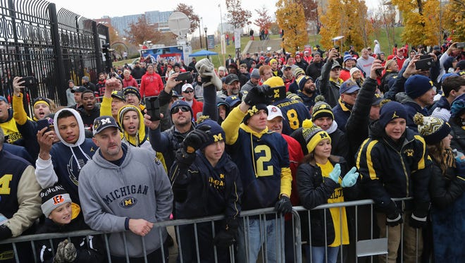Michigan fans watch the team arrive for the game against Ohio State on Saturday, November 26, 2016 at Ohio Stadium in Columbus.