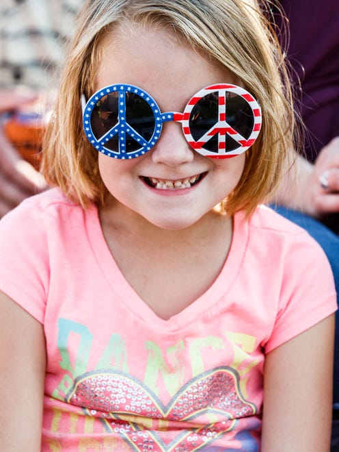 Lilly Windl, 6, of Johnson Creek sports a set of red, white and blue glasses during her visit to the annual Ixonia Town and Country Days Festival on Saturday, August 19, 2017.