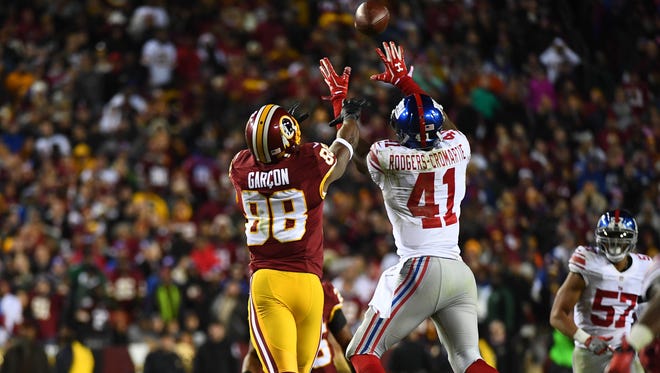 Giants cornerback Dominique Rodgers-Cromartie (41) intercepts a pass intended for Redskins wide receiver Pierre Garcon (88) during the fourth quarter.