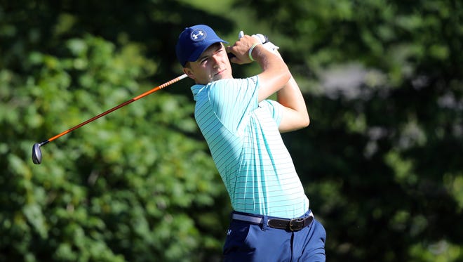 Jordan Spieth tees off on the fourteenth hole during the first round of The Memorial golf tournament at Muirfield Village Golf Club on June 1.