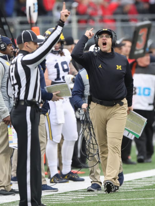 Michigan head coach Jim Harbaugh protests a call during the second half against Ohio State on Saturday, Nov. 26, 2016 at Ohio Stadium.