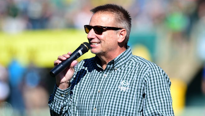 CSU basketball coach Larry Eustachy addresses the crowd at Hughes Stadium during halftime of the Rams' football game against Air Force in 2015.