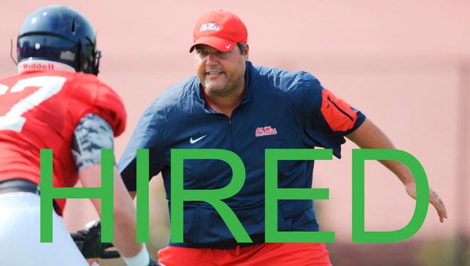 FILE - In this Aug. 10, 2015, file photo, Mississippi offensive line coach Matt Luke works on a drill with linemen during NCAA college football practice in Oxford, Miss. Mississippi coach Hugh Freeze has resigned after five seasons, bringing a stunning end to a once-promising tenure.
The school confirmed Freeze's resignation in a release Thursday night, July 20, 2017. Luke has been named the interim coach. (Bruce Newman/The Oxford Eagle via AP, File) ORG XMIT: MSOXF501