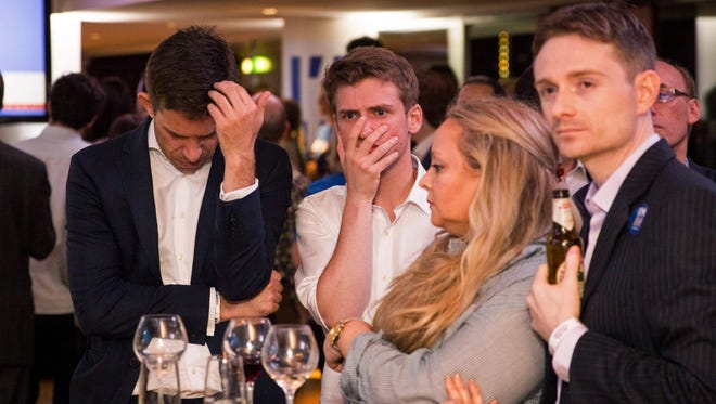 Supporters of the 'Stronger In' Campaign react as results of the EU referendum are announced at a results party at the Royal Festival Hall in London on June 23, 2016.