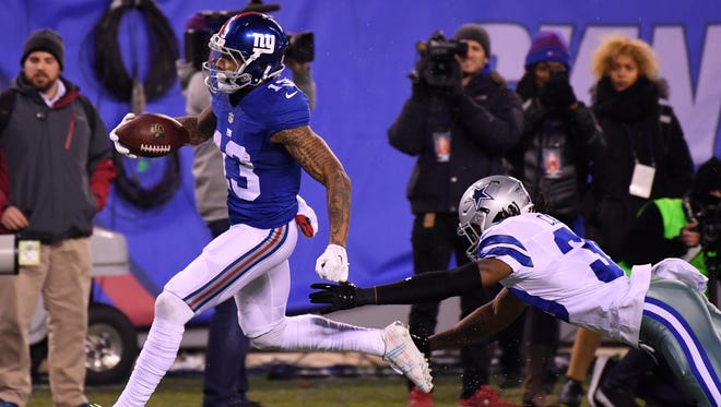Giants wide receiver Odell Beckham (13) scores a touchdown in the second half against the Cowboys.