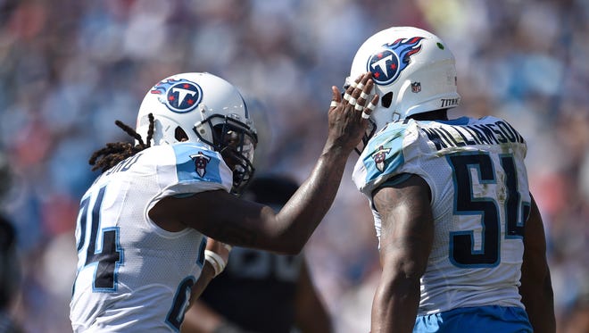 Titans free safety Daimion Stafford (24) and Titans inside linebacker Avery Williamson (54)  celebrate Williamson's interception in the second half at Nissan Stadium Sunday, Sept. 25, 2016, in Nashville, Tenn.