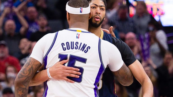 Feb 12, 2017; Sacramento, CA, USA; Sacramento Kings forward DeMarcus Cousins (15) and New Orleans Pelicans forward Anthony Davis (23) hug after the game at Golden 1 Center. The Sacramento Kings defeated the New Orleans Pelicans 105-99. Mandatory Credit: Kelley L Cox-USA TODAY Sports