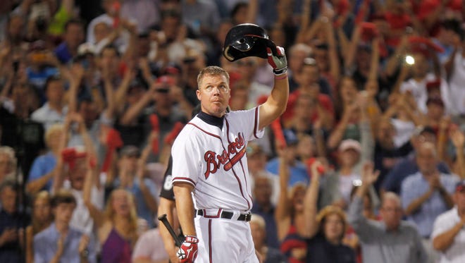 Chipper Jones tips his helmet to the crowd at his last at-bat in 2012.