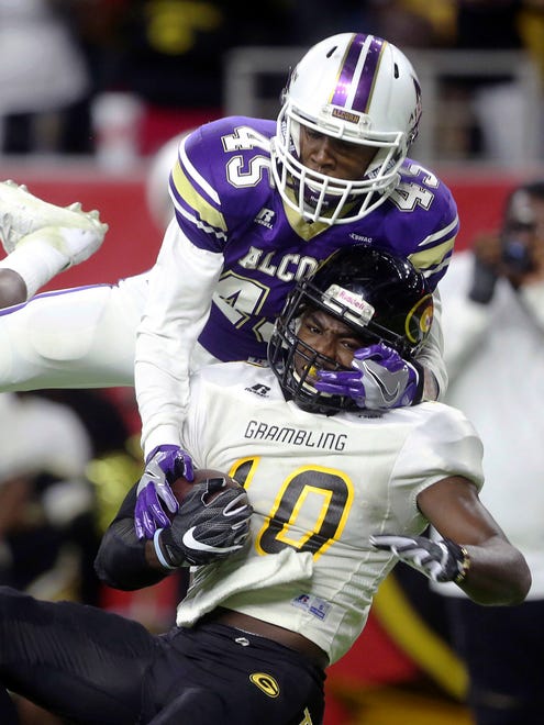 Alcorn State's Javen Morrison tries to intercept a pass to Grambling State's Chad Williams during the Southwestern Athletic Conference championship game in Houston.