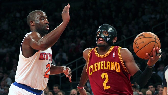 2012: Raymond Felton defends Kyrie Irving on a drive to the basket.