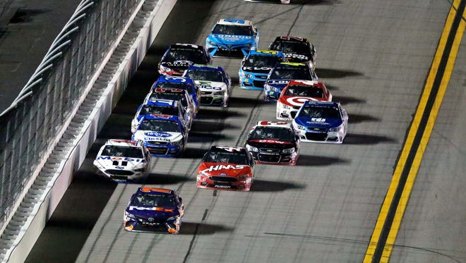 DUEL 2: Denny Hamlin, front, pulls away from Clint Bowyer (14) and Kurt Busch (41) to win.