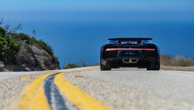 The Bugatti Chiron drives away down the road at The Quail 2016: A Motorsports Gathering.