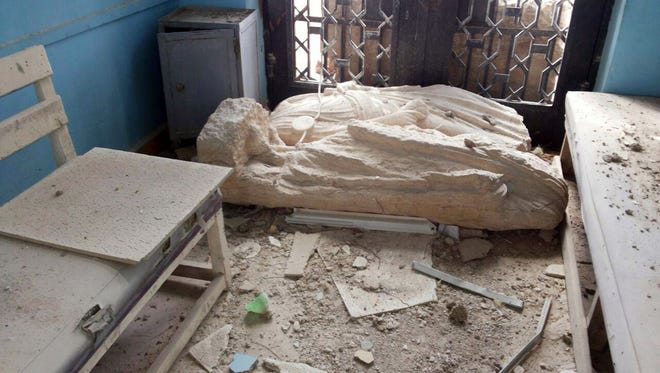 A destroyed statue at the damaged Palmyra Museum, in Palmyra city, central Syria. A Syrian antiquities official says experts have so far removed 150 bombs planted by the Islamic State group inside the archaeological site in the historic town of Palmyra.
