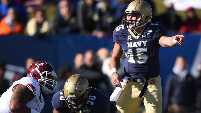 Navy quarterback Will Worth stands at the line of scrimmage during the first quarter against Temple.