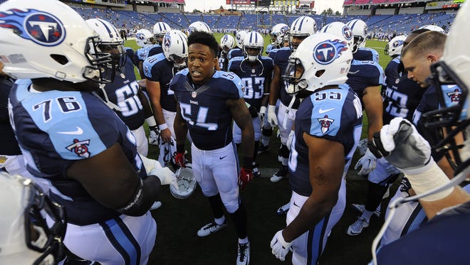 Titans inside linebacker Avery Williamson (54) gets his teammates fired up before the game against the Vikings at Nissan Stadium on Sept. 3, 2015.
